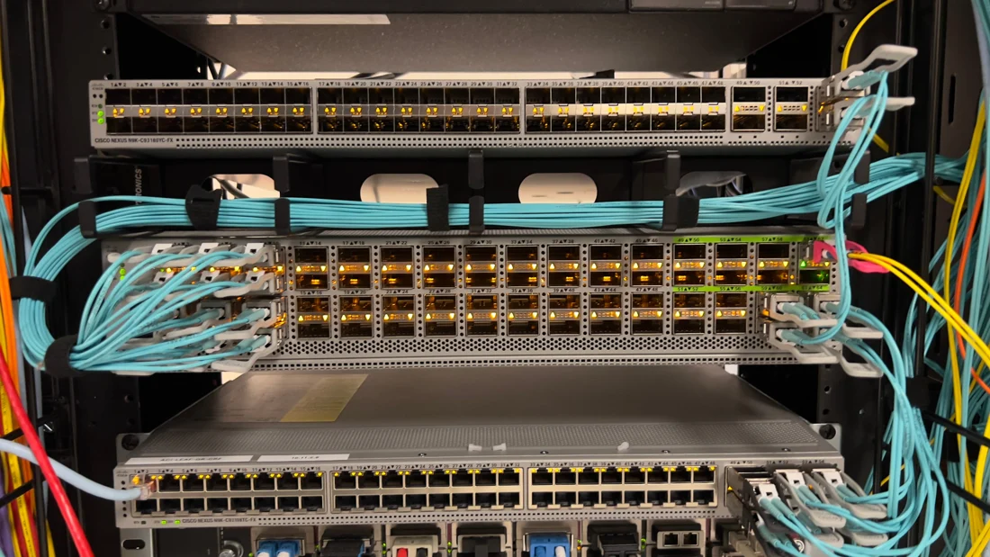Data center switches with aqua fiber cabling and copper connections